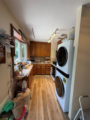 Interior, Kitchen, Tile Countertops, Utility Closets, Washer, Wood Texture Flooring