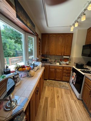 Interior, Kitchen, Tile Countertops, Wood Texture Flooring