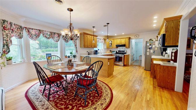 Chandelier, Dining room, Interior, Kitchen, Pendant Lights, Recessed Lighting, Stainless Steel Appliances, Wood Texture Flooring