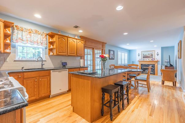 Dining room, Fireplace, Interior, Kitchen, Recessed Lighting, Wood Texture Flooring
