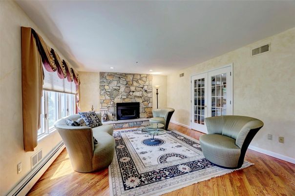 Fireplace, Interior, Living room, Recessed Lighting, Stone Walls, Wood Texture Flooring