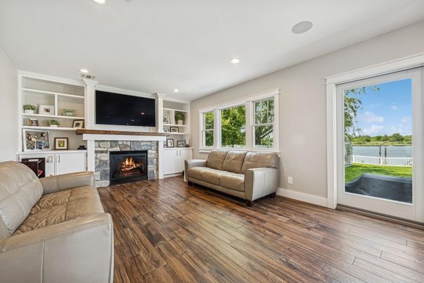 Fireplace, Interior, Living room, Recessed Lighting, Water, Wood Texture Flooring