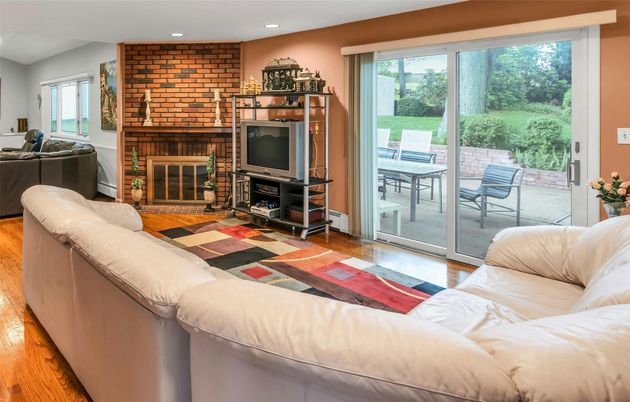 Fireplace, Interior, Living room, Recessed Lighting, Stone Walls, Wood Texture Flooring