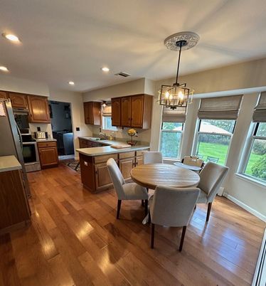 Chandelier, Dining room, Interior, Kitchen, Pendant Lights, Recessed Lighting, Stainless Steel Appliances, Wood Texture Flooring