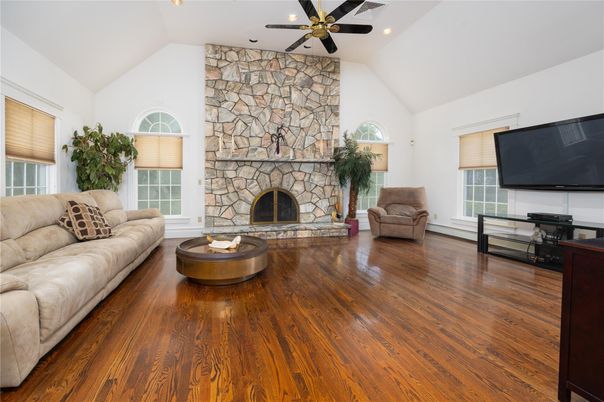 Fireplace, Interior, Living room, Recessed Lighting, Stone Walls, Wood Texture Flooring