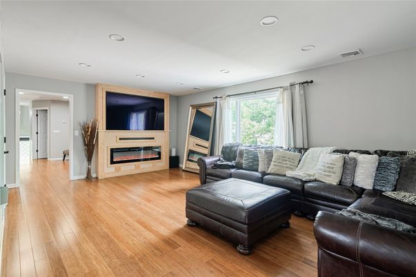 Fireplace, Interior, Living room, Recessed Lighting, Wood Texture Flooring