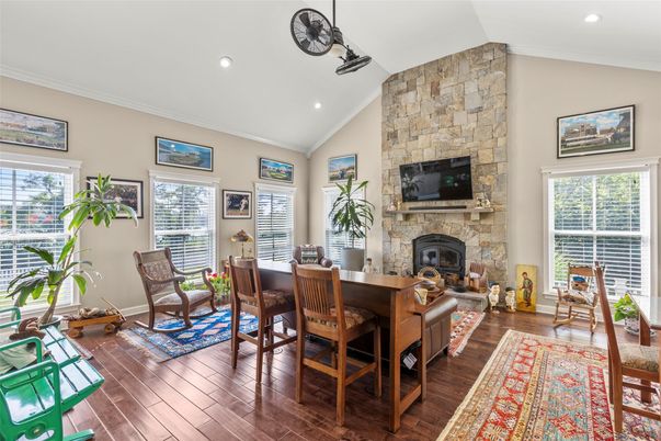 Dining room, Fireplace, Interior, Recessed Lighting, Stone Walls, Wood Texture Flooring