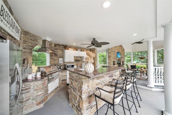 Exterior, Fireplace, Recessed Lighting, Stone Walls