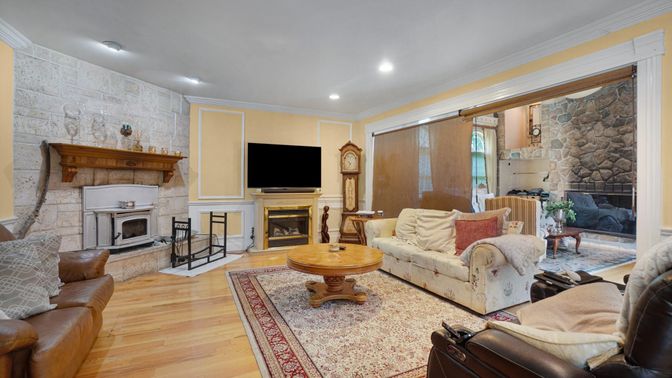 Fireplace, Interior, Living room, Recessed Lighting, Stone Walls, Wood Texture Flooring