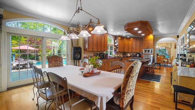 Chandelier, Dining room, Interior, Kitchen, Pendant Lights, Recessed Lighting, Stainless Steel Appliances, Wood Texture Flooring