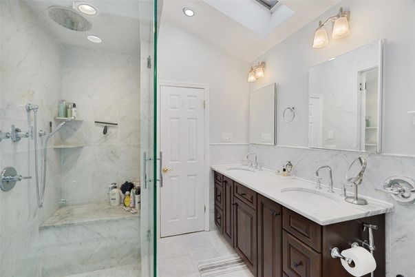 Bathroom, Dual Sink Vanities, Glass Shower, Interior, Marble Walls, Recessed Lighting