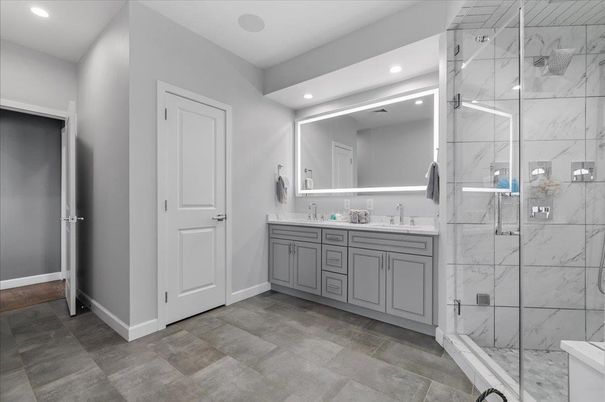 Bathroom, Dual Sink Vanities, Glass Shower, Interior, Marble Walls, Recessed Lighting
