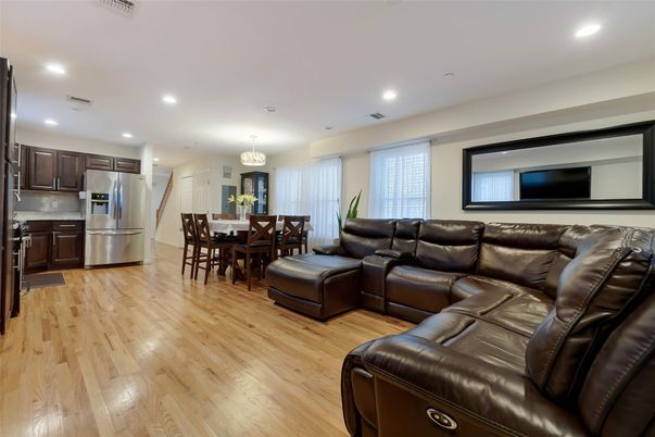 Chandelier, Dining room, Interior, Kitchen, Living room, Recessed Lighting, Stainless Steel Appliances, Wood Texture Flooring