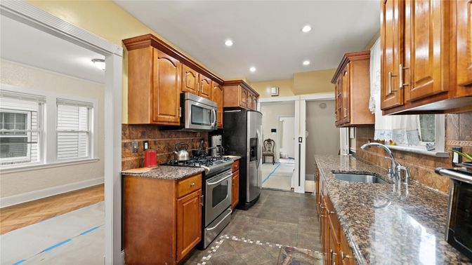 Interior, Kitchen, Recessed Lighting, Washer, Wood Texture Flooring