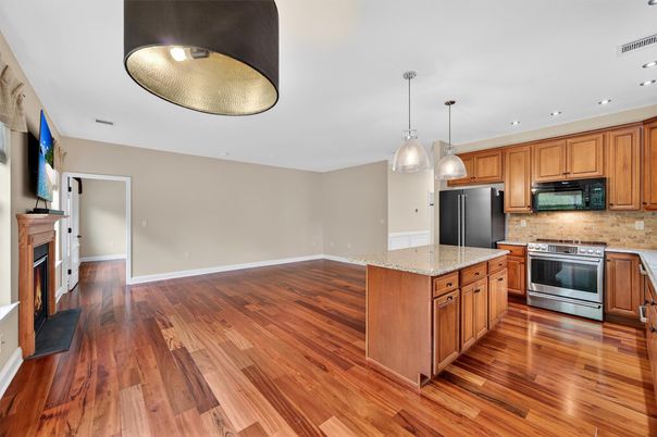 Fireplace, Interior, Kitchen, Pendant Lights, Recessed Lighting, Stainless Steel Appliances, Wood Texture Flooring