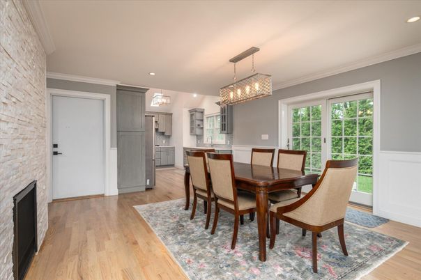 Chandelier, Dining room, Fireplace, Interior, Kitchen, Pendant Lights, Recessed Lighting, Stone Walls, Wood Texture Flooring