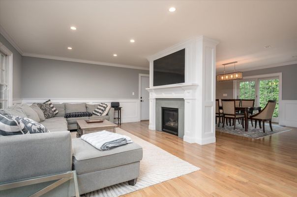 Chandelier, Dining room, Fireplace, Interior, Living room, Pendant Lights, Recessed Lighting, Wood Texture Flooring