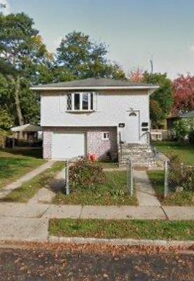 Attached, Backyard, Exterior, Facade, Brick Facade, Raised Ranch