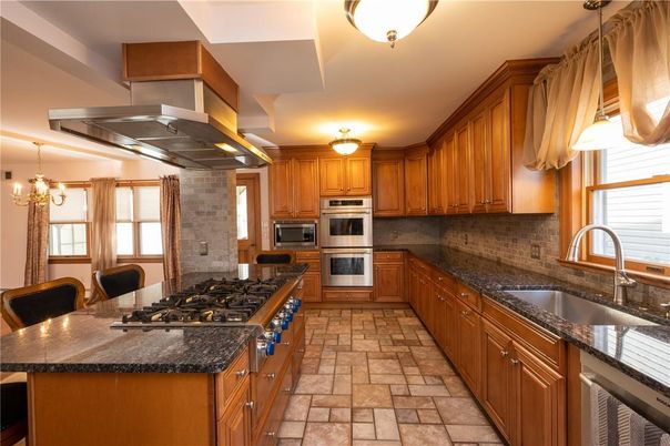 Chandelier, Interior, Kitchen, Pendant Lights, Stainless Steel Appliances, Stone Walls