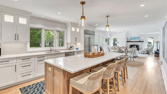 Dining room, Fireplace, Interior, Kitchen, Living room, Pendant Lights, Recessed Lighting, Stainless Steel Appliances, Wood Texture Flooring