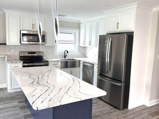 Interior, Kitchen, Marble Walls, Recessed Lighting, Stainless Steel Appliances, Wood Texture Flooring