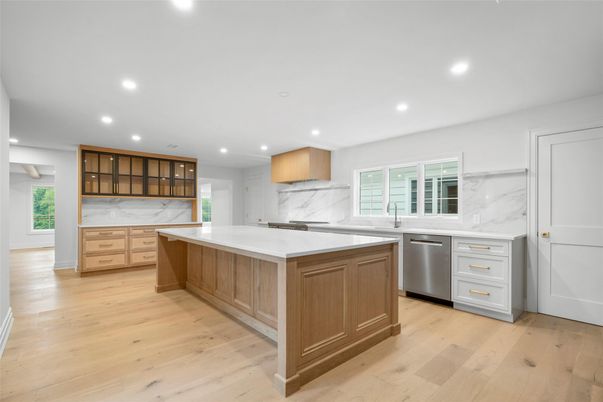 Interior, Kitchen, Marble Walls, Recessed Lighting, Stainless Steel Appliances, Wood Texture Flooring