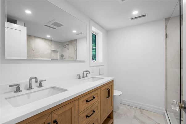 Bathroom, Dual Sink Vanities, Glass Shower, Interior, Marble, Marble Walls, Recessed Lighting