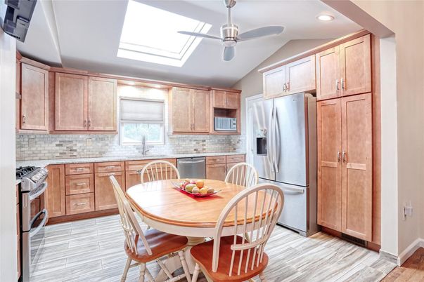 Dining room, Interior, Kitchen, Recessed Lighting, Stainless Steel Appliances, Wood Texture Flooring
