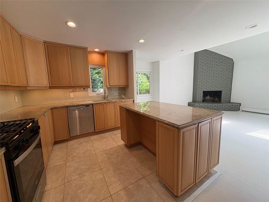Fireplace, Interior, Kitchen, Recessed Lighting, Stainless Steel Appliances, Stone Walls