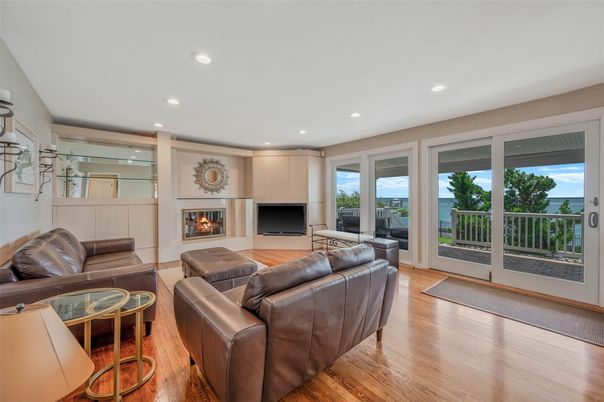 Fireplace, Interior, Living room, Recessed Lighting, Water, Wood Texture Flooring