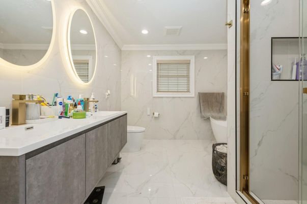 Bathroom, Dual Sink Vanities, Glass Shower, Interior, Marble, Marble Walls, Recessed Lighting