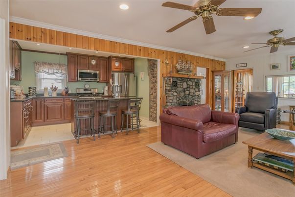 Fireplace, Interior, Kitchen, Living room, Recessed Lighting, Stone Walls, Wood Texture Flooring