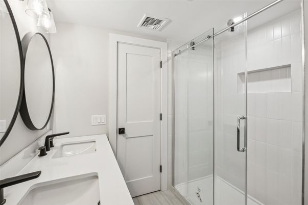 Bathroom, Dual Sink Vanities, Glass Shower, Interior, Wood Texture Flooring