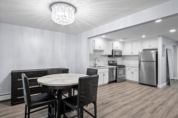 Chandelier, Dining room, Interior, Kitchen, Recessed Lighting, Stainless Steel Appliances, Wood Texture Flooring
