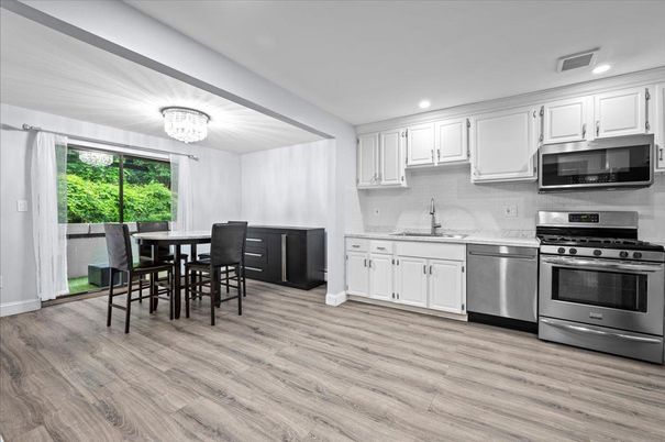 Chandelier, Dining room, Interior, Kitchen, Recessed Lighting, Stainless Steel Appliances, Wood Texture Flooring