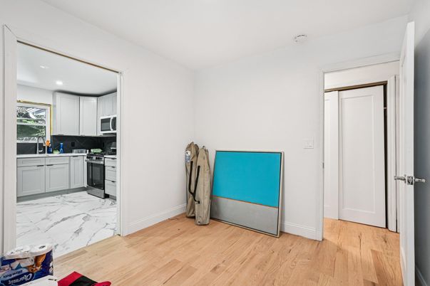 Interior, Kitchen, Marble, Recessed Lighting, Washer, Wood Texture Flooring