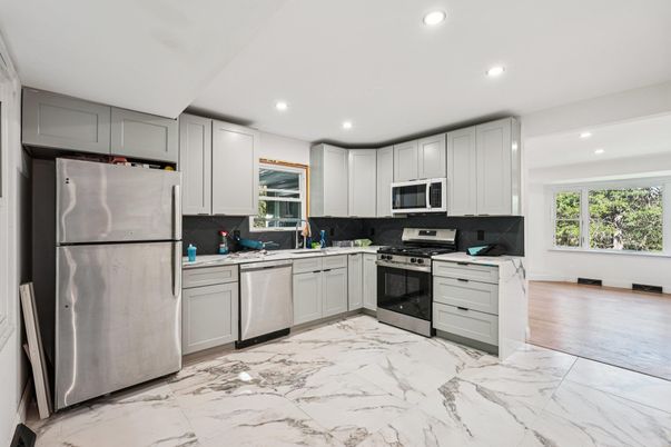 Interior, Kitchen, Marble, Recessed Lighting, Stainless Steel Appliances, Wood Texture Flooring