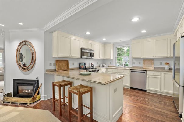 Fireplace, Interior, Kitchen, Recessed Lighting, Stainless Steel Appliances, Wood Texture Flooring
