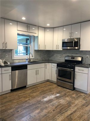 Interior, Kitchen, Recessed Lighting, Stainless Steel Appliances, Wood Texture Flooring