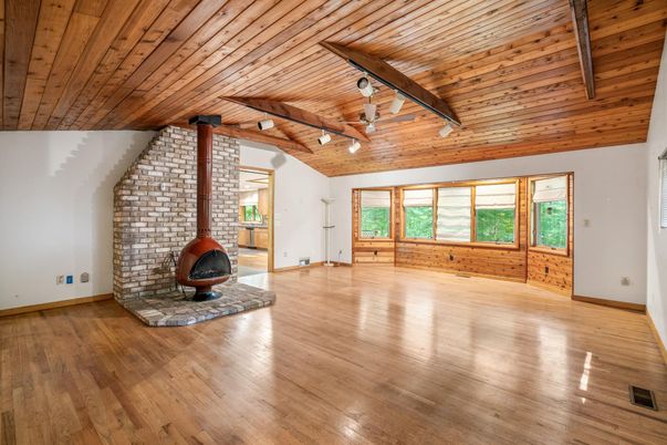 Empty room, Fireplace, Interior, Stone Walls, Wooden Beams, Wooden Ceilings, Wood Texture Flooring