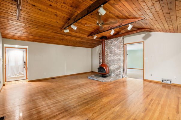 Empty room, Fireplace, Interior, Stone Walls, Wooden Beams, Wooden Ceilings, Wood Texture Flooring