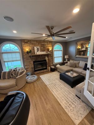 Fireplace, Interior, Living room, Recessed Lighting, Stone Walls, Wood Texture Flooring
