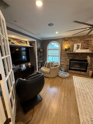 Fireplace, Interior, Living room, Recessed Lighting, Stone Walls, Wood Texture Flooring