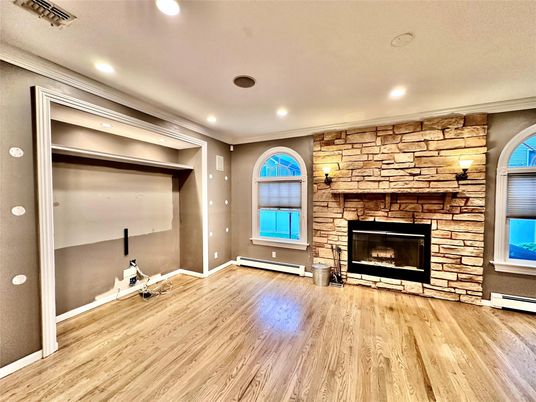 Empty room, Fireplace, Interior, Recessed Lighting, Stone Walls, Wood Texture Flooring