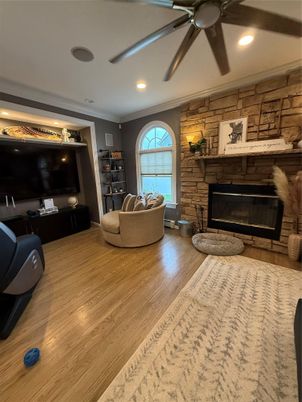 Fireplace, Interior, Living room, Recessed Lighting, Stone Walls, Wood Texture Flooring