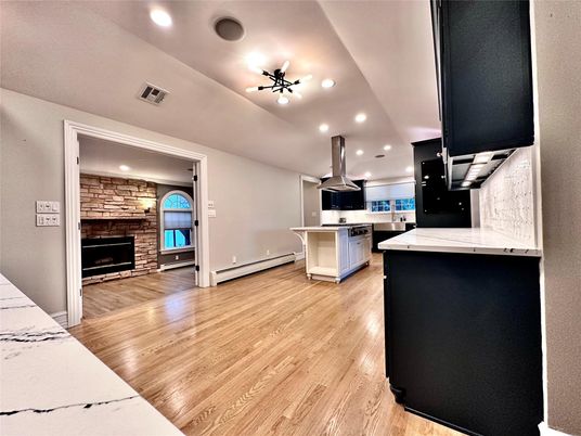 Fireplace, Interior, Kitchen, Recessed Lighting, Stone Walls, Wood Texture Flooring