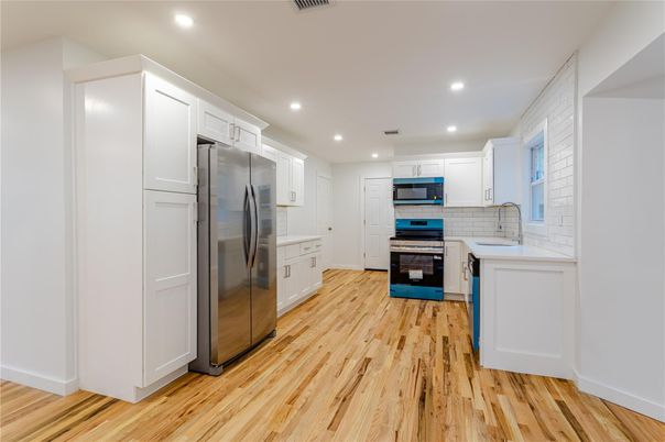 Interior, Kitchen, Recessed Lighting, Stainless Steel Appliances, Wood Texture Flooring