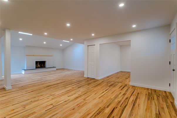 Empty room, Fireplace, Interior, Recessed Lighting, Wood Texture Flooring