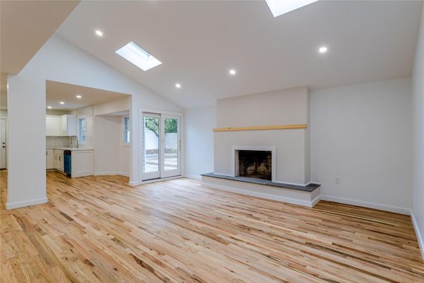 Empty room, Fireplace, Interior, Kitchen, Recessed Lighting, Wood Texture Flooring