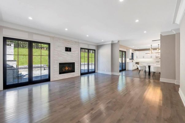 Empty room, Fireplace, Interior, Kitchen, Pendant Lights, Recessed Lighting, Stone Walls, Wood Texture Flooring